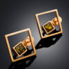 Gold-plated-earrings-Gravity-1.jpeg Gravity Earrings & sparkling Green Amber