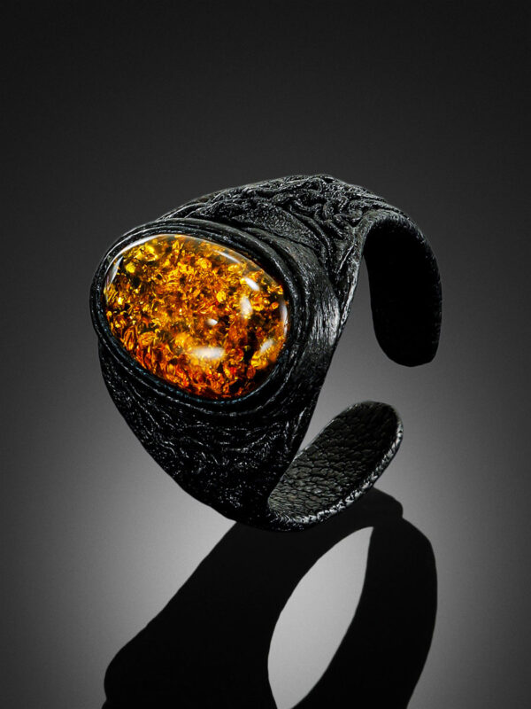 Leather-ring-with-large-sparkling-greenish-amber-2.jpeg Leather Ring with Large Sparkling Amber